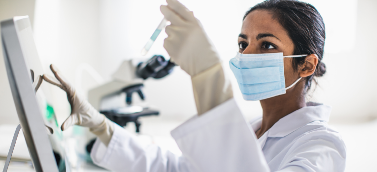 Lab technician looking at a sample.