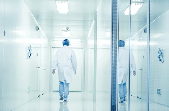 Medical technician walking down hallway