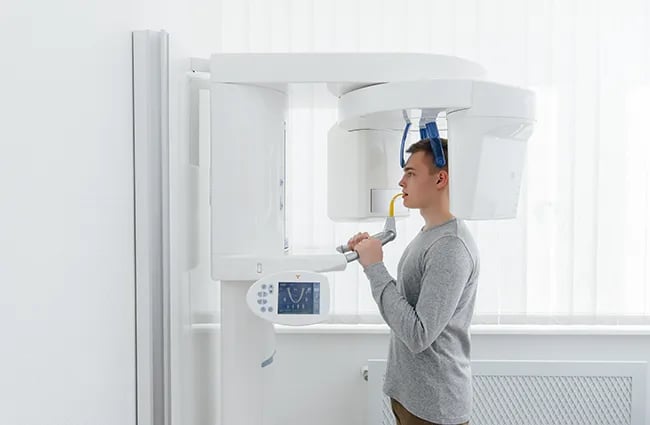Patient being scanned using high tech medical device