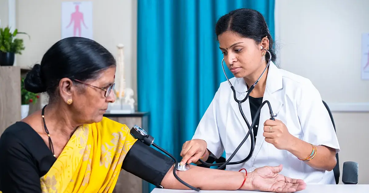 Healthcare worker measuring a patient's blood pressure