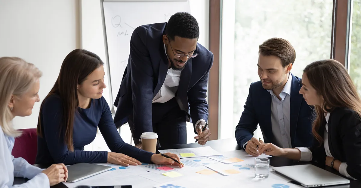 Business professionals collaborating at a table.