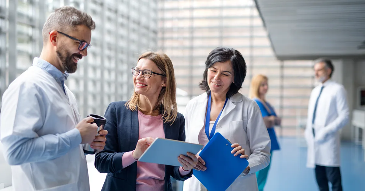 Group of medical professionals smiling in a common area